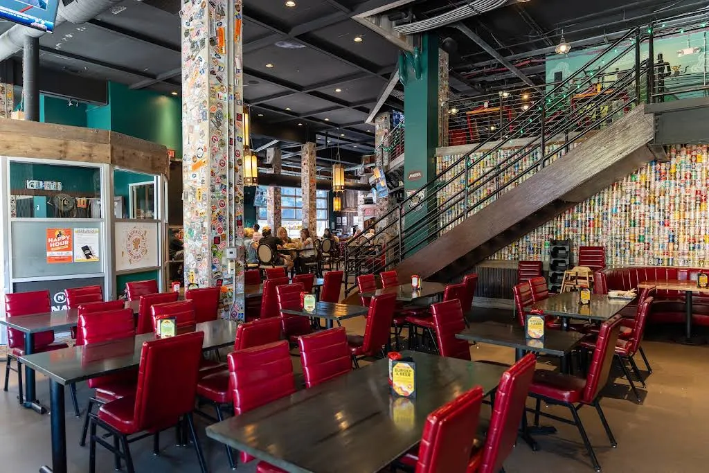 A photo of the interior of the Hopcat restaraunt showing empty tables and chairs